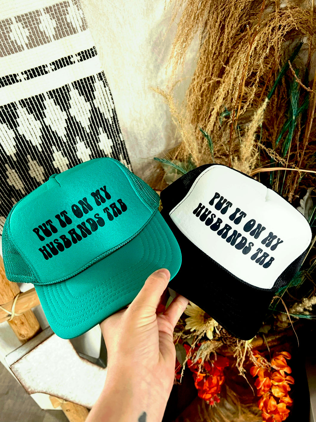 Put It On My Husbands Tab Trucker Hat